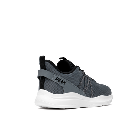Sneakers Peak pour homme en gris Paloma Ash, au design moderne et minimaliste, dotée d’une maille respirante et d’une semelle légère pour un confort optimal lors du running ou des activités quotidiennes.