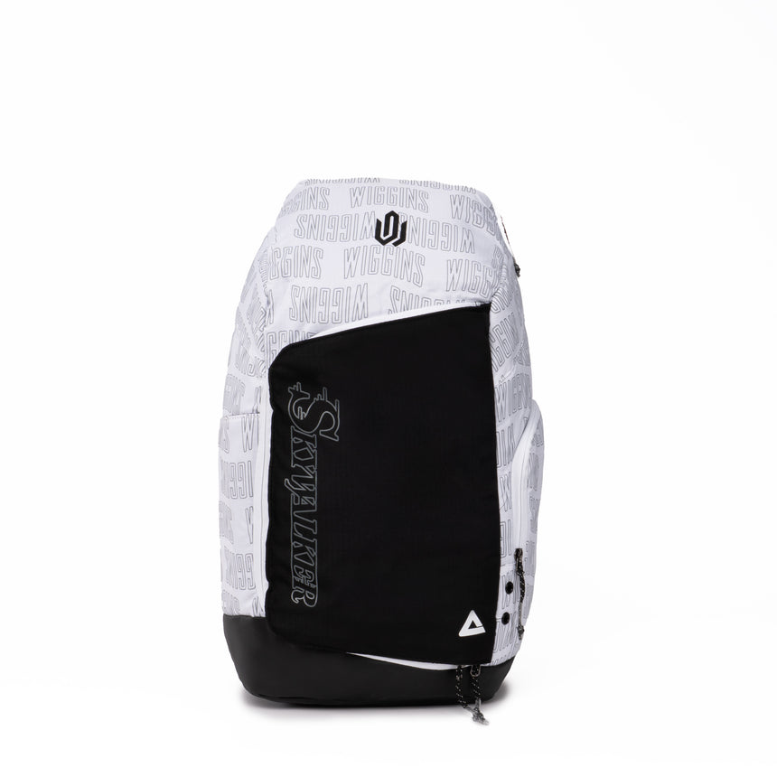 White and black PEAK backpack featuring 'Skywalker' text on the front pocket, Wiggins print pattern across the top section, and triangular PEAK logo at the bottom, displayed on a clean white background