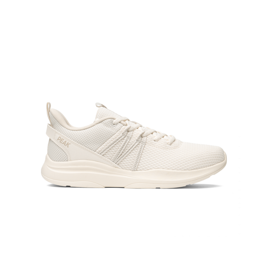 Sneakers Peak pour femme en toile beige clair, design minimaliste avec maille respirante et semelle légère, idéales pour un look casual et un confort durable au quotidien.