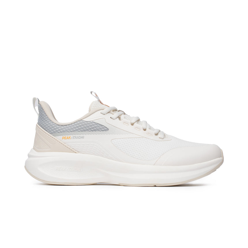 Sneakers Peak Taichi Flow pour femme, coloris beige et gris, avec semelle Taichi souple et légère. Chaussure respirante au design élégant, idéale pour le confort quotidien.