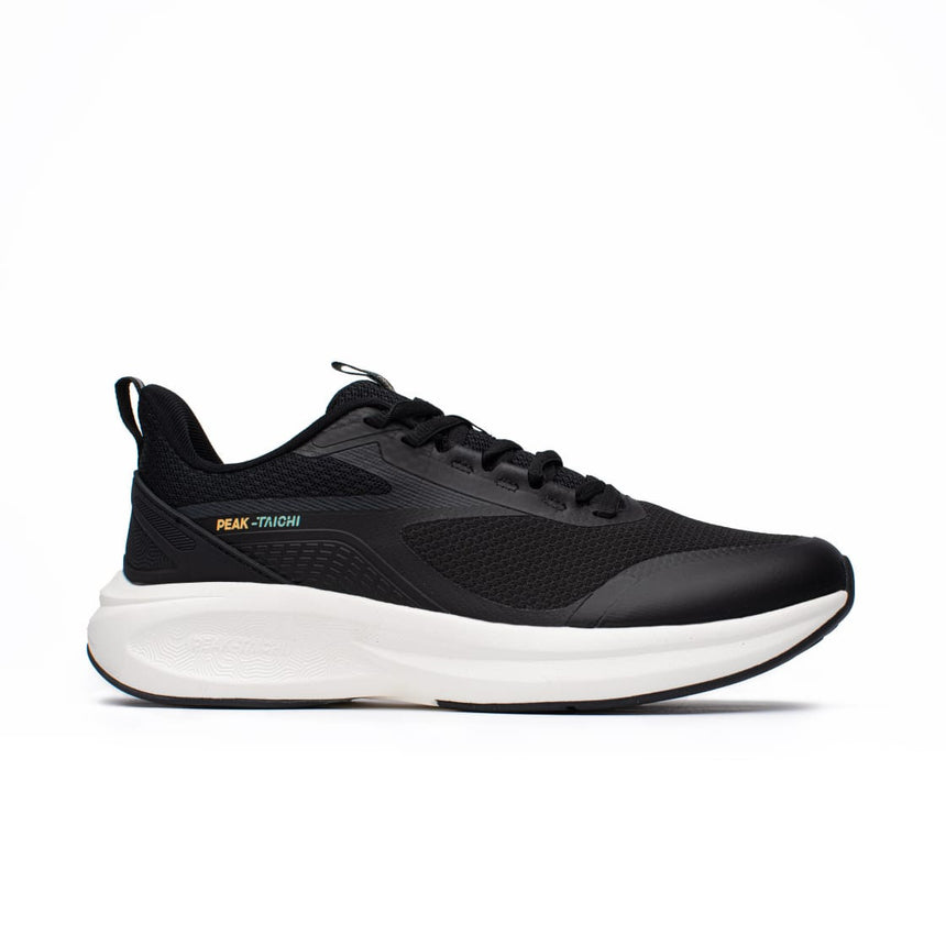 Sneakers Peak Taichi Flow pour homme, coloris noir et blanc, avec semelle Taichi ultra confortable. Chaussure légère, respirante et idéale pour un usage quotidien.