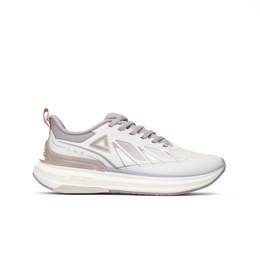 Sneakers Peak Taichi pour homme, coloris beige et blanc cassé, avec semelle amortissante et design élégant. Chaussure légère et performante, idéale pour le running et le quotidien.