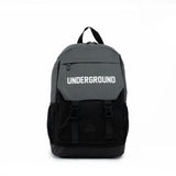 Black and grey PEAK backpack with 'UNDERGROUND' text on the front flap and buckle straps, displayed on a clean white background