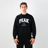 sweat-shirt PEAK noir porté par un homme, logo PEAK sur la poitrine, style sportif et décontracté.