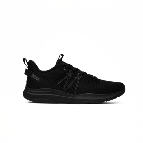 Baskets Peak entièrement noires pour Femme, tige en maille respirante et semelle légère pour un confort optimal au quotidien et un style sportif urbain.