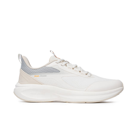 Sneakers Peak Taichi Flow pour femme, coloris beige et gris, avec semelle Taichi souple et légère. Chaussure respirante au design élégant, idéale pour le confort quotidien.