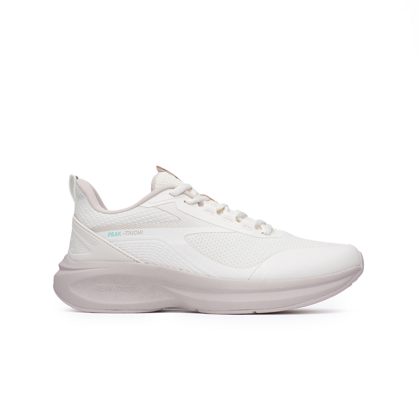 Sneakers Peak Taichi Flow pour femme, coloris blanc cassé, avec semelle Taichi pour un confort optimal. Chaussure légère, élégante et respirante, idéale pour un usage quotidien.