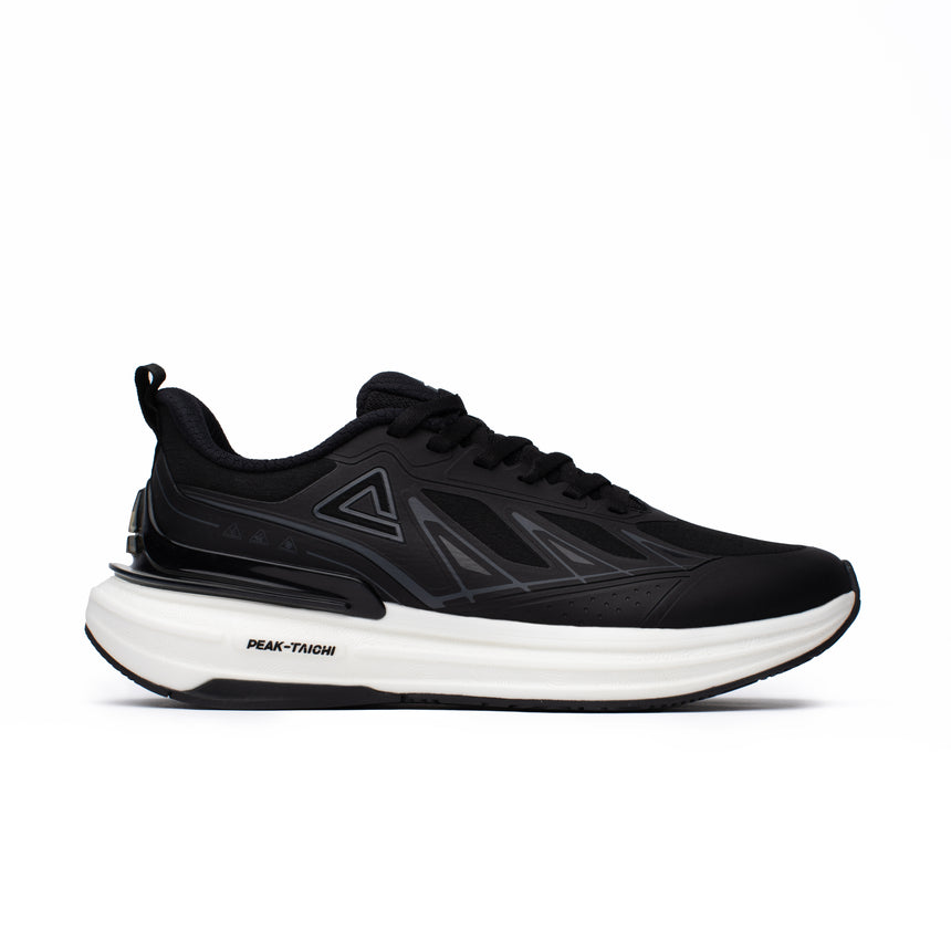 Sneakers Peak Taichi pour homme, coloris noir et blanc, dotée de la technologie Taichi pour un confort dynamique. Chaussure légère, amortissante et élégante.