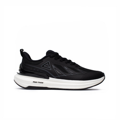 Sneakers Peak Taichi pour homme, coloris noir avec semelle blanche, alliant technologie Taichi, confort supérieur et design moderne. Chaussure idéale pour la course et le quotidien.
